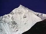 
After 50 minutes from Marpha, I rounded a bend in the trail, and ahead was the long white ridge leading to Dhaulagiri resplendent in the early morning sun.
